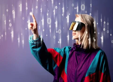 Blonde in VR glasses with binary code around Stock Photos