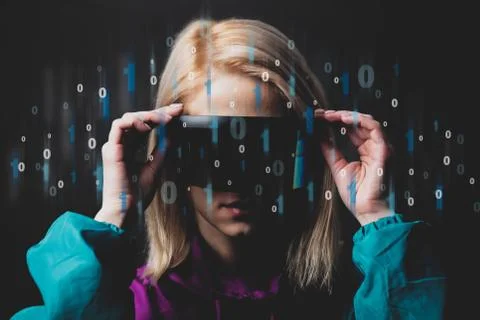 Blonde in VR glasses with binary code around Stockfoto's