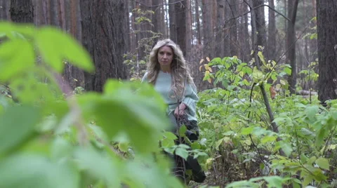 Blonde walks in the woods Stock Footage 49020162