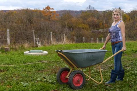 Blonde with a wheelbarrow Stock Photos
