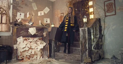 Blonde wizard school student is walking in the school with a suitcase, arriving Stock Footage 149036309