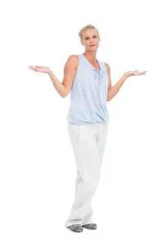 Blonde woman with arms raised in question looking at camera Stock Photos