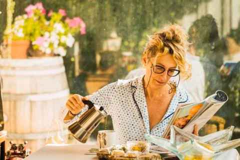 Blonde woman at breakfast time. Stock Photos