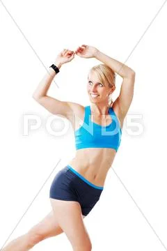 Blonde woman in sports wear doing gymnastics Stock Photos
