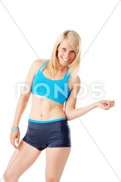 Blonde woman in sports wear smiling Stock Photos