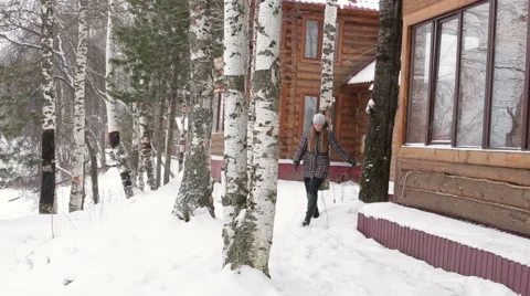 Blonde woman is walking in the winter park Stock Footage 65338853