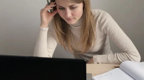 Blonde woman working on laptop Video stock 59722577