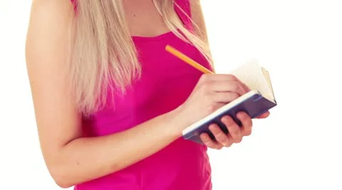 Blonde writing in notepad 库存影片 11128689