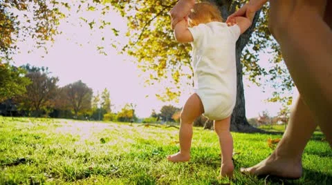 Blonde Young Child Taking First Steps Stock Footage 10721950