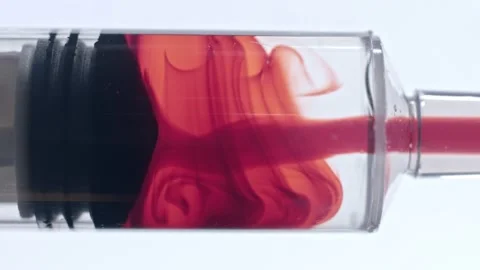 Blood and saline solution drawn into syringe tube during vaccine pharmaceuti Stock Footage 146478011