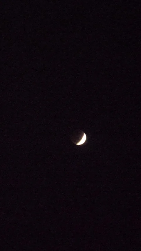 Blood crescent moon Lunar Eclipse on black background in the dark night sky Stock Footage 337929094