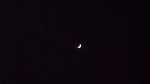 Blood crescent moon Lunar Eclipse on black background in the dark night sky Stock Footage 337929121