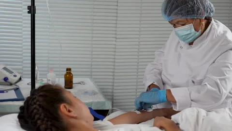 Blood Draw or IV Insertion on Patient's Arm Stock Footage 314699199