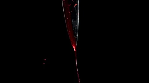 Blood Drip Falling from a Sharp Metallic Kitchen Knife Blade Stock Footage 331101703