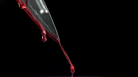 Blood Drip from Sharp Metal Blade Against Dark Background 库存影片 331101559