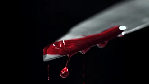 Blood Drip from a Sharp Metal Knife Blade over Dark Background 库存影片 331101835