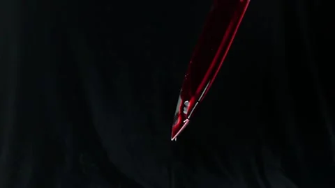 Blood dripping from the knife, close up, selective focus. Stock Footage 156191725