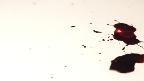 Blood dripping upon white background Vidéo 233467313