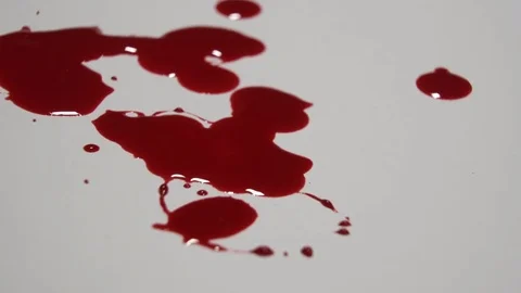 Blood dripping on a white surface. Stock Footage 82900466