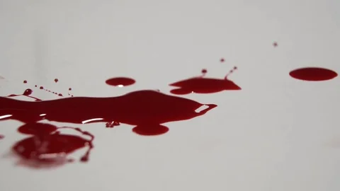 Blood dripping on a white surface. Stock Footage 82900478