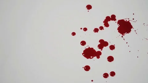 Blood dripping on a white surface. Stock Footage 82900501
