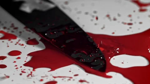 Blood Drips Falling Onto a Sharp Metal Kitchen Knife on a White Surface 库存影片 331101514