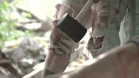 Blood drips from the sledgehammer to the floor Stock Footage 78205608