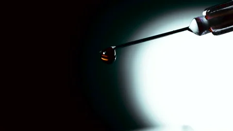 Blood drips from the tip of the needle. Close up Stock Footage 143214689