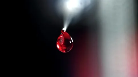 Blood Drop Falling in Slow Motion Against a Dark Background 库存影片 331101692
