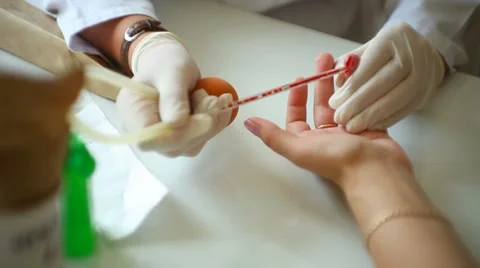 Blood from a finger on the analysis Stock Footage 8571481