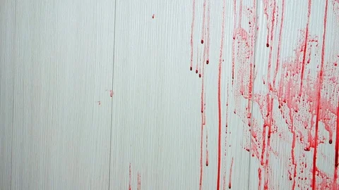 Blood flow on the wall, a human in danger. A female hand reaches out, holding on Video stock 128151664