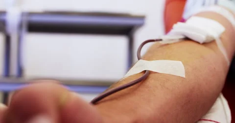 Blood flowing in pipe from human arm, donation or test, detail 動画素材 153183347