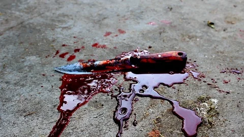 Blood flows from the knife. Halloween. Stock Footage 117590190