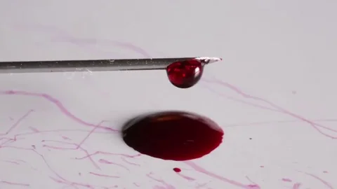 Blood flows from syringe on a white background Stock Footage 69178371