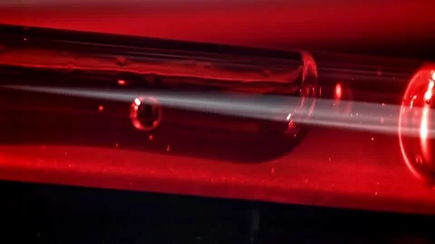 Blood Liquid Moving Through a Transparent Glass Medical Tube Vidéo 331101779