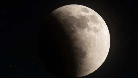 Blood Moon Eclipse of 2014 with Earth's shadow almost halfway across Stock Photos
