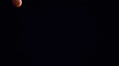 Blood moon as the sun rises Stock Footage 43873087