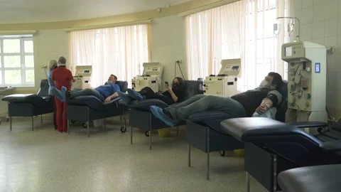 Blood Plasma Donation process, hand squeezing a rubber ball, COVID-19 corona 스톡 동영상 144288565