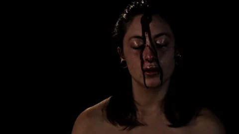 Blood pours down face of crying girl Stock Footage 99072273