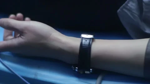 The blood pressure and pulse testing device diagnoses the patient Stock Footage 261642353