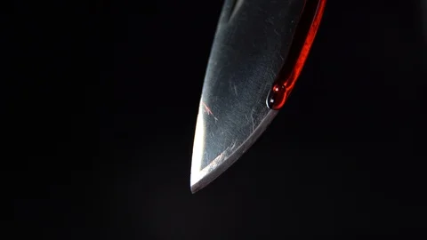Blood running down a blade close up Stock Footage 123049234
