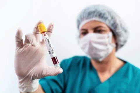 Blood Sample in a flask for analyzing Corona virus and producing vaccine. Corona Stock Photos