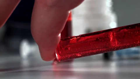 Blood Sample in Glass Vial Held by Researcher for Clinical Laboratory Analysis Stock Footage 331101691