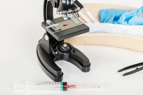 Blood sample under a microscope in a laboratory, concept for testing for viru Stock Photos