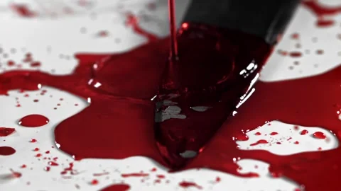 Blood Splattering over a Sharp Metal Knife on a White Surface 库存影片 331101719