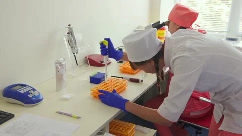 Blood test and microscope using Stock Footage 234813358
