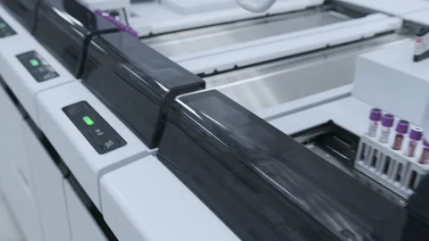 Blood tests, automatic line. COVID-19. There are many machines nearby. Stock Footage 148193092