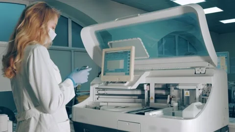Blood tests using biochemical analysis. A laboratory worker examines the samples Stock Footage 152511243