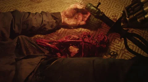 Bloodied corpse lying on carpet Vídeos de archivo 67554890