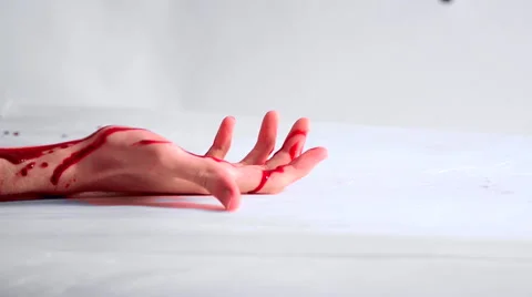 Bloodied hand falling to the ground Stock Footage 55076212